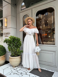Off-shoulder white maxi gown with romantic ruffle detail